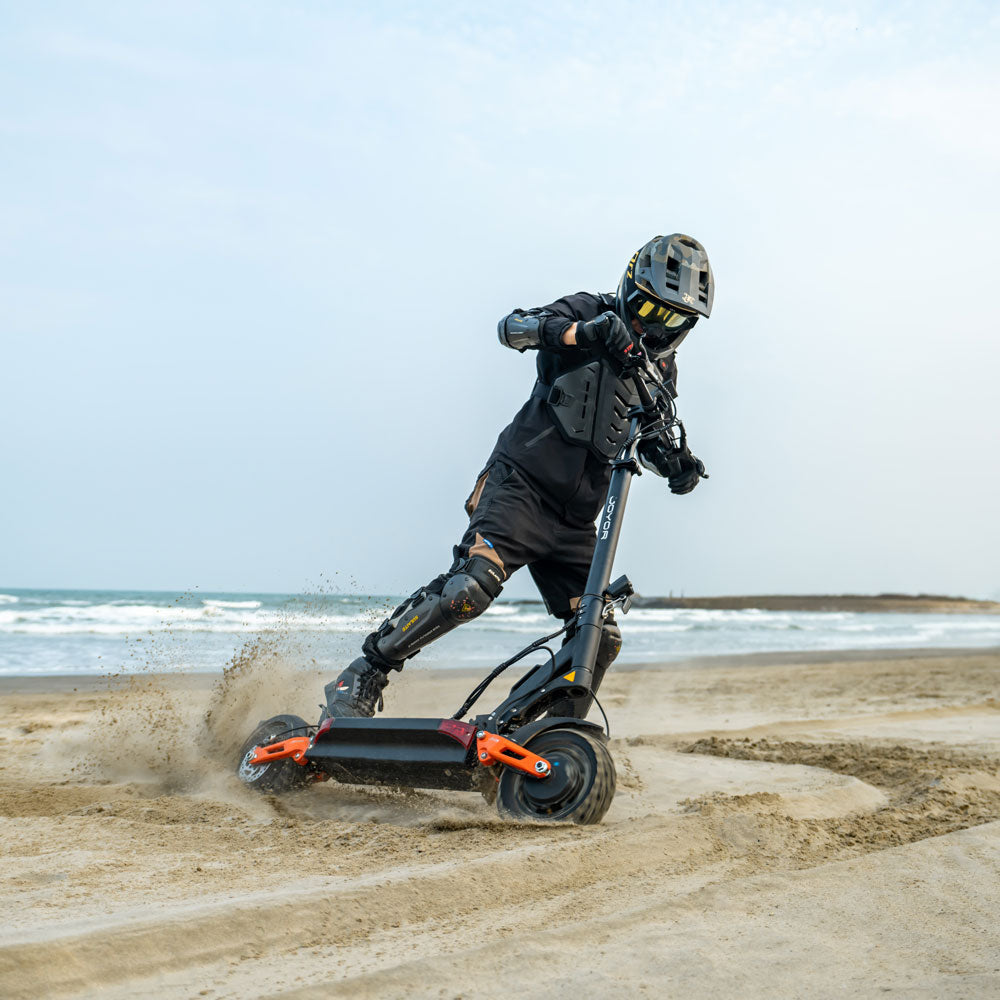 electric scooter joyor t10 lifestyle riding beach on the beach