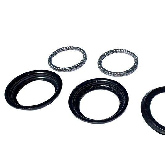 Set of mechanical bearings and seals on a white background