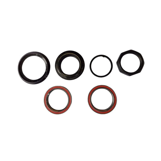 A set of five circular mechanical seals or O-rings in black and red, arranged on a plain white background.