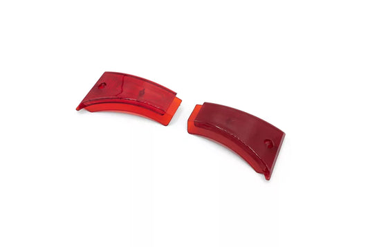 A pair of red sidelight covers for electric scooters.